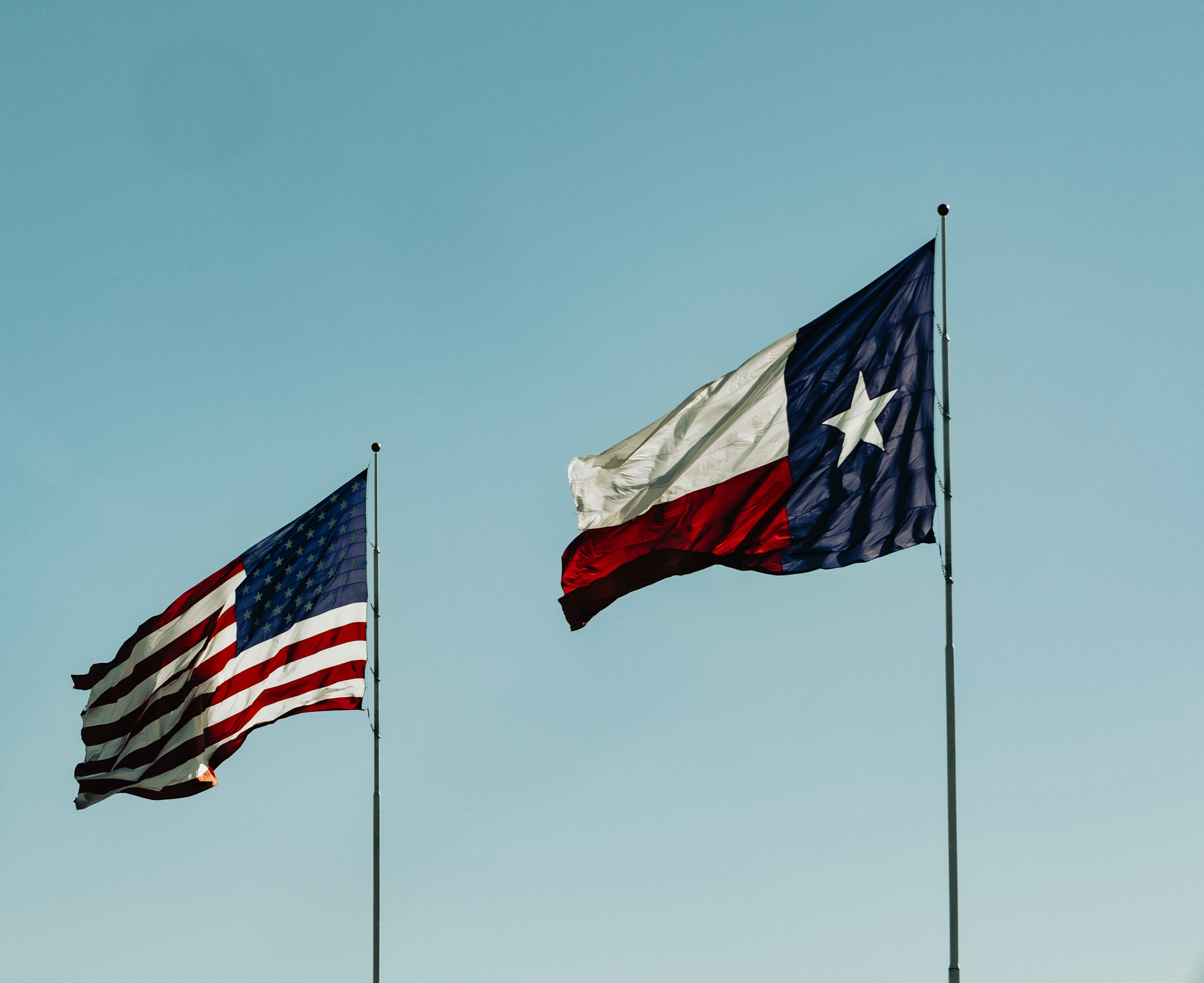 Texas and American Flag blowing in the wind 